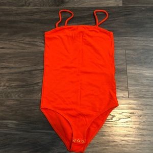 Bright orange bodysuit